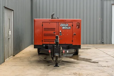 2023 Ditch Witch HX50 mud mixing system, front hitch view, trailer-mounted, red enclosure, exhaust stack, ventilation louvers, safety chains