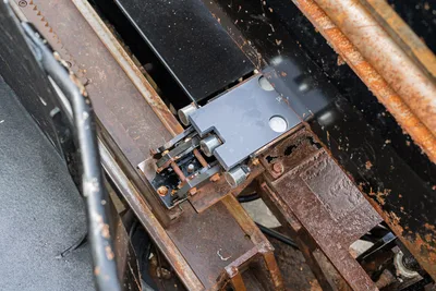 2016 Vermeer D23x30 S3 carriage slide block and rack-and-pinion thrust mechanism, close-up showing wear and surface rust