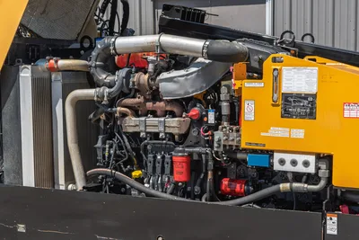 2019 Vermeer D40x55 S3 open engine compartment showing diesel engine, turbo, hydraulic pumps, filters, and lubricant service chart