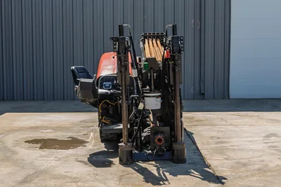 Rear view of 2018 Ditch Witch JT20 HDD showing drill pipe rack, operator station, hydraulic stabilizers, and rubber tracks.