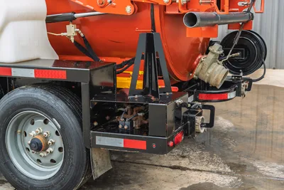 2019 Ditch Witch HX30 vacuum excavator rear view showing debris tank, water valves, hydraulic components, and trailer tires.