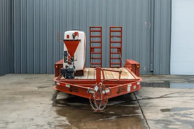 2019 Belshe WB14-2EP mud mixing trailer, front view, red frame, white poly tank, hopper, gas engine, wood deck, dual ramps