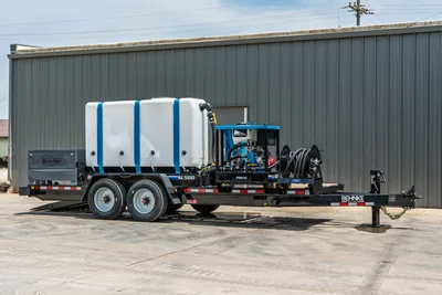 Behnke TBCT2220ET-BT-R HDD mud mixing trailer, side view, white poly tank, blue pump unit, hose reel, tandem axle, Better Built toolbox