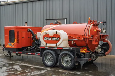 2021 Ditch Witch HX50 mud recycler, rear 3/4 view, tandem-axle trailer, vacuum tank, fresh water tank, suction hoses visible