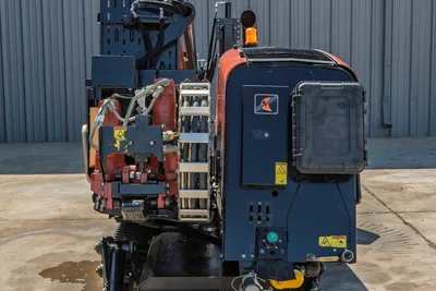 Rear view of 2018 Ditch Witch JT20 HDD, showing engine compartment, track assembly, hose track, and drill pipe carriage.