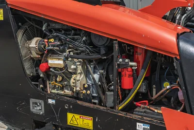 Engine compartment view of 2018 Ditch Witch JT10 horizontal directional drill revealing clean 66hp engine and Baldwin filters.