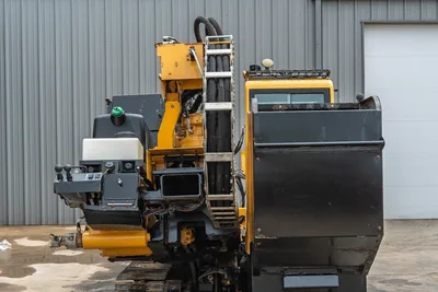 Rear view of 2017 Vermeer 40x55 S3 HDD drill showing engine housing, hydraulic hoses, drill rack, and steel tracks.