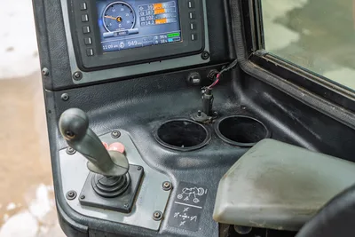 Ditch Witch AT40 operator station with digital display, joystick control, and cup holders showing 4,980 engine hours.