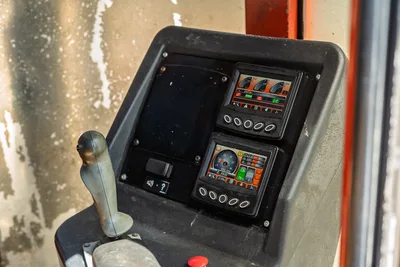 Ditch Witch JT30 All Terrain operator station with digital display console, hydraulic control joysticks, and gauge cluster.
