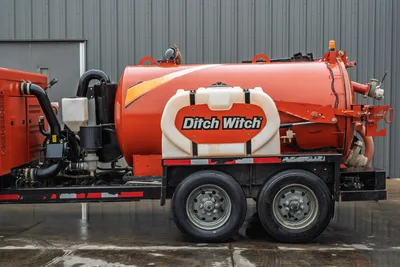 2021 Ditch Witch HX50 mud recycler, side profile, orange tank, dual-axle trailer, fresh water tank, hydraulic plumbing visible