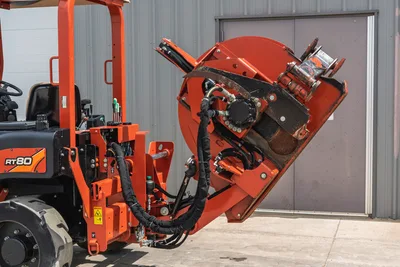 2017 Ditch Witch RT80 trencher rear view, showing hydraulic attachment, operator station, and tire assembly in good condition.