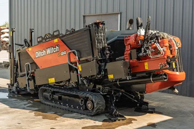 2020 Ditch Witch JT24 directional drill, side profile showing tracks, engine housing, drill carriage, and hydraulic systems.