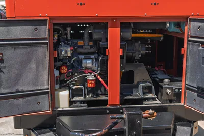 2023 Ditch Witch HX30 mud recycler engine compartment open, showing diesel engine, alternator, fuel filter, hydraulic hoses, red frame