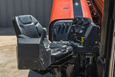 2021 Ditch Witch JT20 operator station featuring control console, joystick, gauges, and seat in high-angle perspective view.