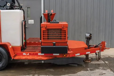 2015 Ditch Witch MR90 mud recycler trailer, rear view showing engine compartment, hopper, grated deck, water tank, and pintle hitch