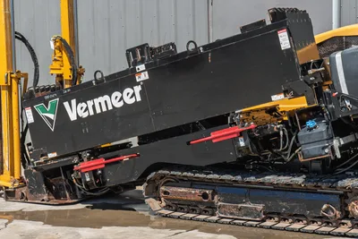 2020 Vermeer D24x40 S3 HDD drill frame angled view showing black carriage, red pipe rack guides, rubber tracks, and hydraulic lines