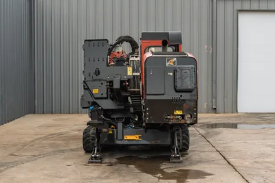 2016 Ditch Witch JT25 HDD drill, rear view, rubber tracks, anchor legs, vise assembly, hydraulic hoses, red/black finish