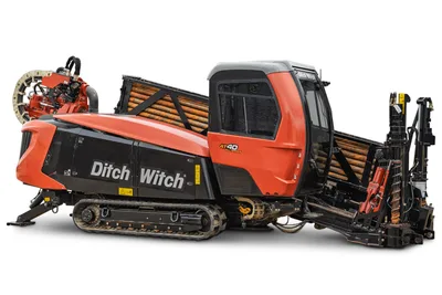 2021 Ditch Witch AT40 HDD in side profile showing track undercarriage, operator cab, drill pipe rack, and rotation drive.