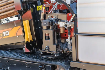 Ditch Witch JT10 rotary head and control manifold assembly with drill pipe attachment, side angle view