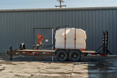 2023 MAXX-D C6X mud mixing trailer, side view, white poly tank, Ditch Witch mixer, tandem axle, dovetail ramps, clean condition