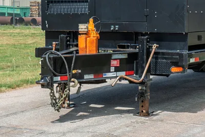 2023 American Augers M300DH mud unit trailer tongue, ball hitch, safety chains, jack stands, hydraulic hoses, orange pump visible