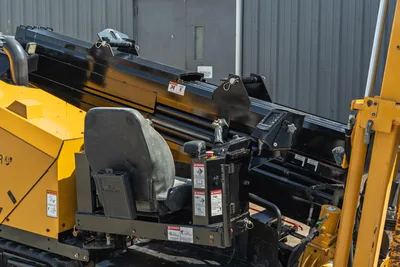 2022 Vermeer D23x30 S3 HDD drill operator seat, drill carriage, vise assembly, and drill rod close-up, low-hour condition
