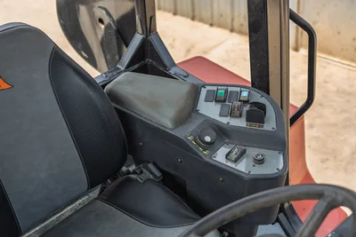2024 Ditch Witch RT125Q operator seat, armrest console with toggle switches, rocker controls, and steering wheel visible