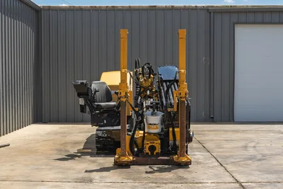2021 Vermeer D24x40 S3 HDD drill, rear view showing anchor posts, carriage, operator seat, rubber tracks, hydraulic lines