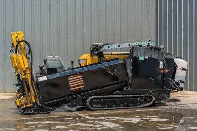 2021 Vermeer D8x12 HDD drill, driver-side profile, yellow carriage, rubber tracks, operator seat, drill rod loaded, water tank visible