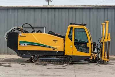 Side profile of 2017 Vermeer 40x55 S3 HDD with enclosed cab, steel tracks, drill rack, and engine compartment housing.