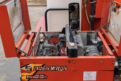 2015 Ditch Witch MR90 mud mixer engine compartment open, FM25h power unit, exhaust stack, radiator, hydraulic components visible