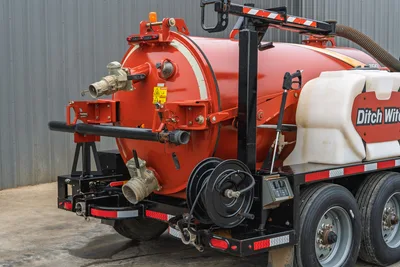 2019 Ditch Witch HX30 vacuum excavator rear view showing spoil tank, discharge valve, hose reel, and water supply tank.