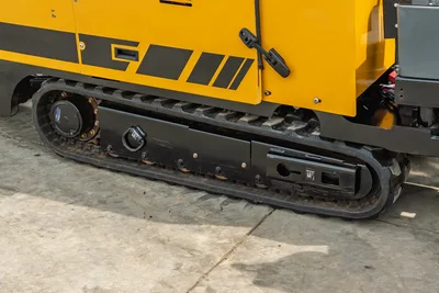2024 Vermeer D20x22 S3 HDD drill close-up of rubber track undercarriage, drive sprocket, and yellow side panel with black decals