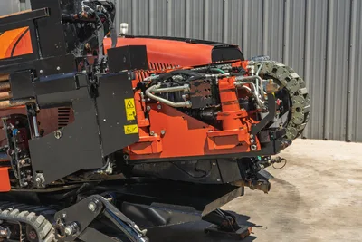 2021 Ditch Witch JT20 drill carriage, hydraulic hose assembly, engine enclosure, and steel tracks in profile view.