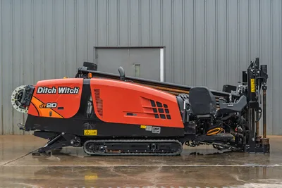 Ditch Witch JT20 HDD drill rig side view with tracked carrier, 74 hp engine, drill head, and pullback winch assembly