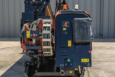 2021 Ditch Witch JT20 HDD drill pipe rack, rotation hydraulic assembly, and rear engine compartment access panel view.