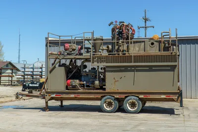 2018 Vermeer MCT-450 mud recycler, full side view on tandem-axle trailer, mixing tank, centrifugal pumps, red motor, piping visible
