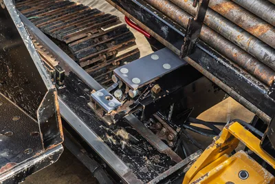 2018 Vermeer D24x40 S3 hydraulic manifold block, carriage frame, rubber track, and loaded drill pipe rack, overhead view
