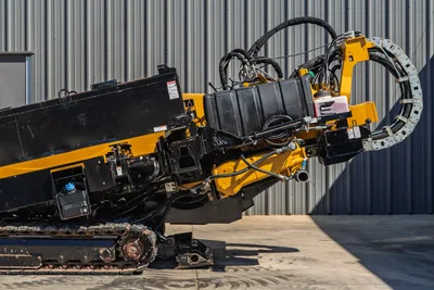 2021 Vermeer D40x55 S3 HDD drill, close-up of carriage, vise, hydraulic hoses, pipe carousel, and rubber tracks