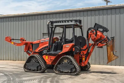 2024 Ditch Witch RT125Q tracked trencher, 3/4 view, enclosed cab, RC30 vibratory plow front, rear trencher boom with chain