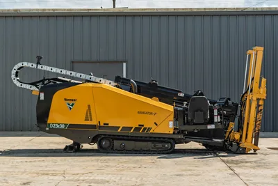 2022 Vermeer D23x30 S3 Navigator HDD drill, left side profile, yellow/black, rubber tracks, drill frame raised, cable carrier visible