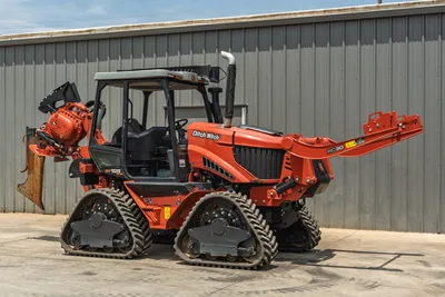 2024 Ditch Witch RT125Q quad-track trencher, enclosed cab, RC30 attachment, chain trencher boom, 3/4 front angle view, low hours