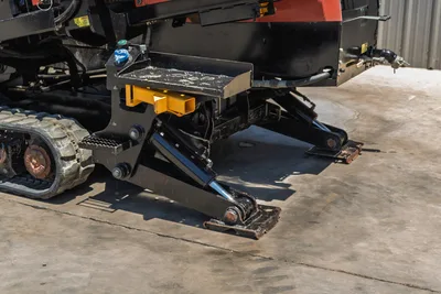 2018 Ditch Witch JT30 All Terrain hydraulic anchor/stabilizer assembly, rubber track, yellow vise block, close-up side view