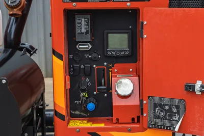Ditch Witch HX30 control panel, digital display, ignition, throttle, and open service hatch with maintenance diagram.