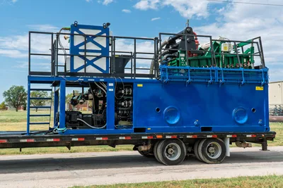 2023 American Augers M300DH mud recycler on flatbed trailer, blue tank, shaker deck, pump manifold, access ladder, side profile view