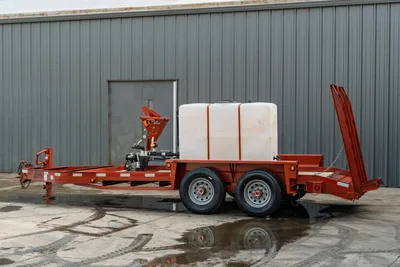 2019 Belshe WB14-2EP mud mixing trailer, driver-side view, red steel frame, white poly water tank, Brush Witch mixer, tandem axle