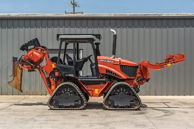 2024 Ditch Witch RT125Q ride-on trencher, full side profile, rubber tracks, enclosed cab, rear chain trencher, RC30 vibratory plow attachment