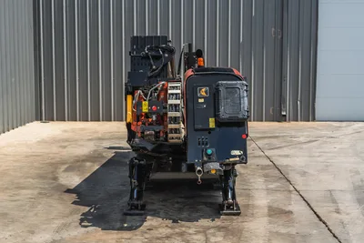 2021 Ditch Witch JT20 HDD drill, rear view, hydraulic lines, pipe rack, stabilizer legs deployed, operator panel, Ditch Witch branding visible