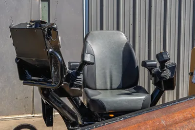 2021 Vermeer D40x55 S3 HDD operator station with gray suspension seat, dual joystick controls, and display mount