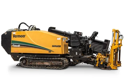 2014 Vermeer D24x40 Series II Navigator HDD drill, 3/4 side view, rubber tracks, loaded drill pipe rack, operator seat visible